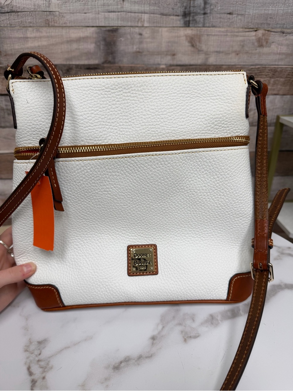 Dooney & Bourke White with red lining crossbody bag